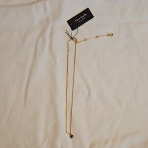 Kate Spade Gold Necklace with Dark Purple Accent
